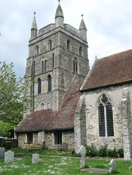A stone church with turret in a cemetery