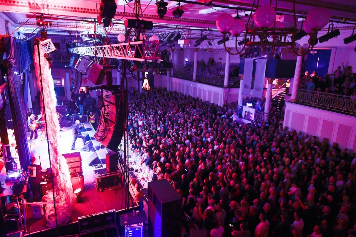 Leas Cliff Hall Grand Hall filled with people for a standing music gig.